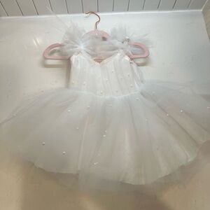 Custom made dresses . All fit around 6-9 months red one 12 months